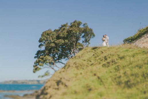 Newlywed clifftop kiss