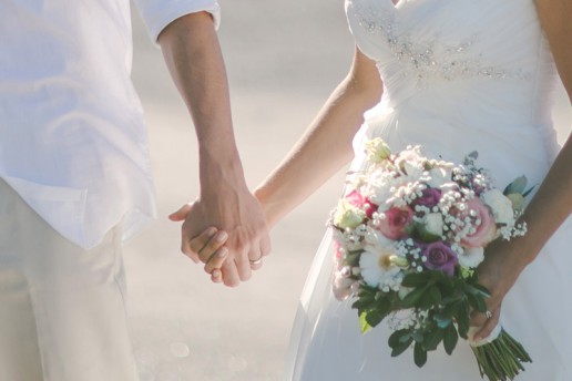 Newlyweds hold hands